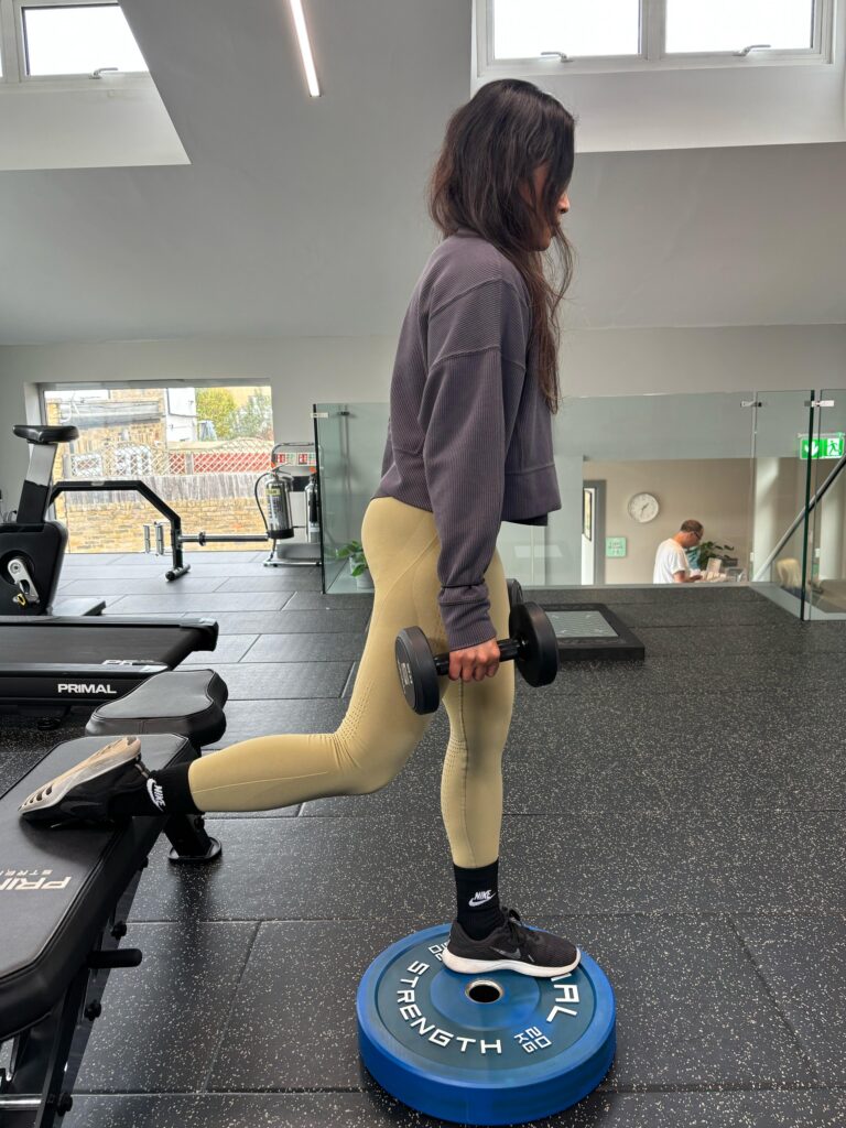 Woman doing a Bulgarian Split Squat for Marathon Training,