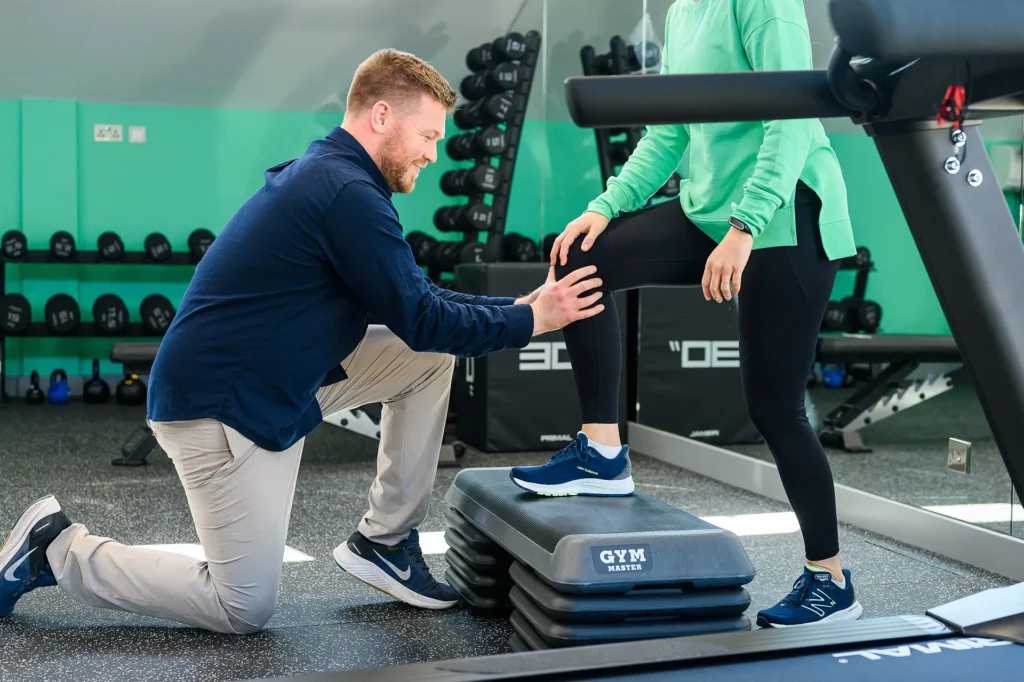 ACL Rehabilitation when a Physiotherapist reviews a patient's knee after an ACL injury at Mint Wellbeing.